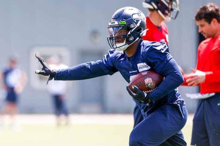 Seattle Seahawks running back Ken Walker III (9) participates in a drill during an OTA workout at the Virginia Mason Athletic Center.
